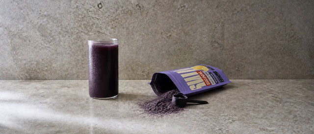 A glass of the Signal blend beside its pouch