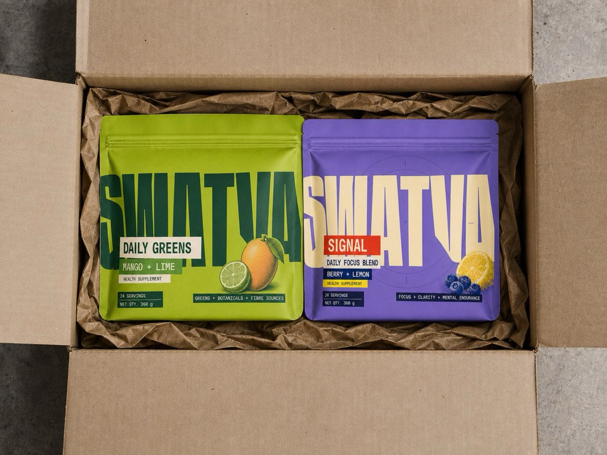 Two sealed pouches in a plain shipping box lined with brown paper